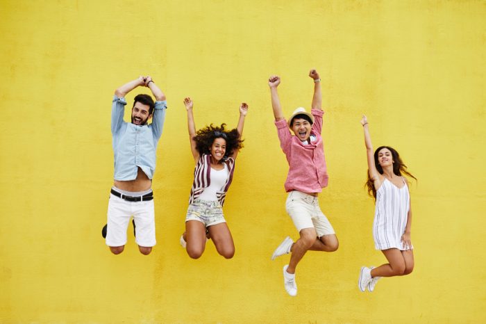 Yellow happy jumping people e1597477875401
