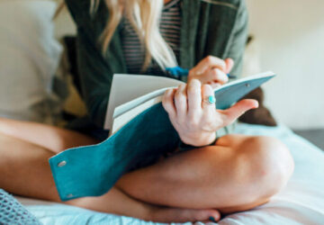 woman writing diary while sitting on bed 1200x628 facebook